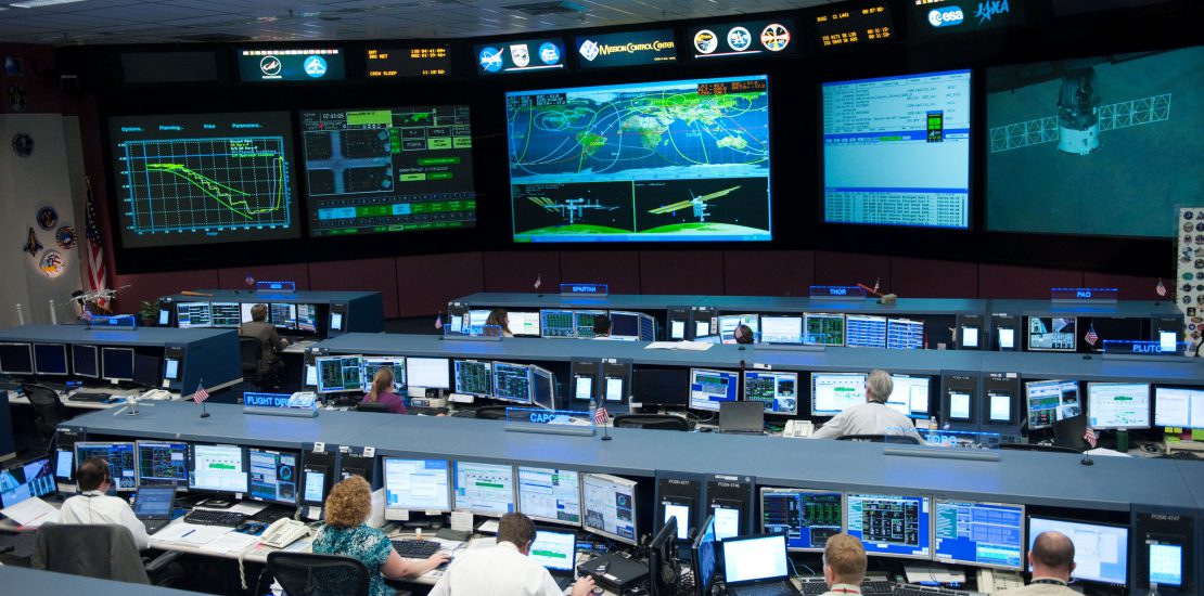 Flight controllers and Flight Director Chris Edelen in the FCR-1 during NASA astronaut Joseph Acaba, flight engineer, and his two Russian crewmates, Soyuz Commander Gennady Padalka and Flight Engineer Sergei Revin, on board the Soyuz TMA-04M spacecraft docking to the space station's Rassvet module at 11:38 p.m.  Photo Date: May 16, 2012.  Location: Building 30 - FCR1.  Photographer: Robert Markowitz